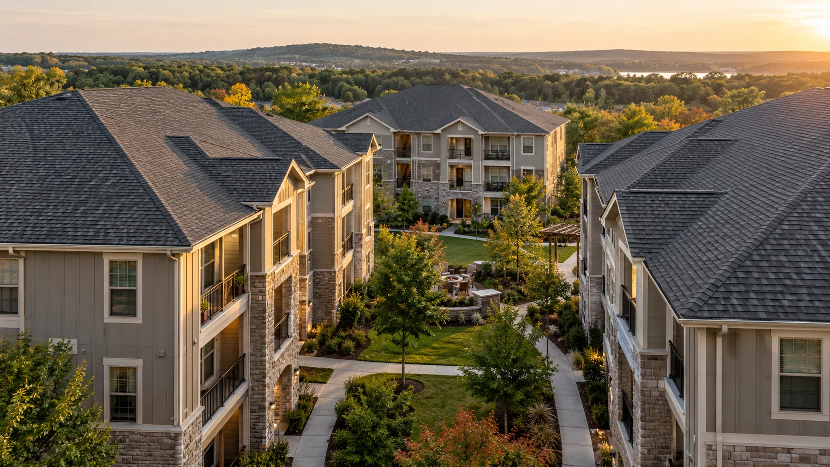Architectural illustration of an apartment community with charcoal shingle roofs